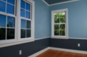 interior of home with no furniture and two toned blue walls