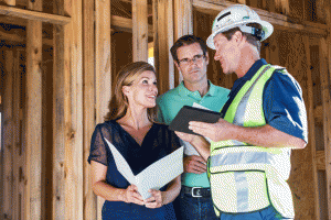 builder and homeowner talking in new construction.
