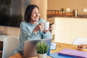 smiling woman drinking coffee