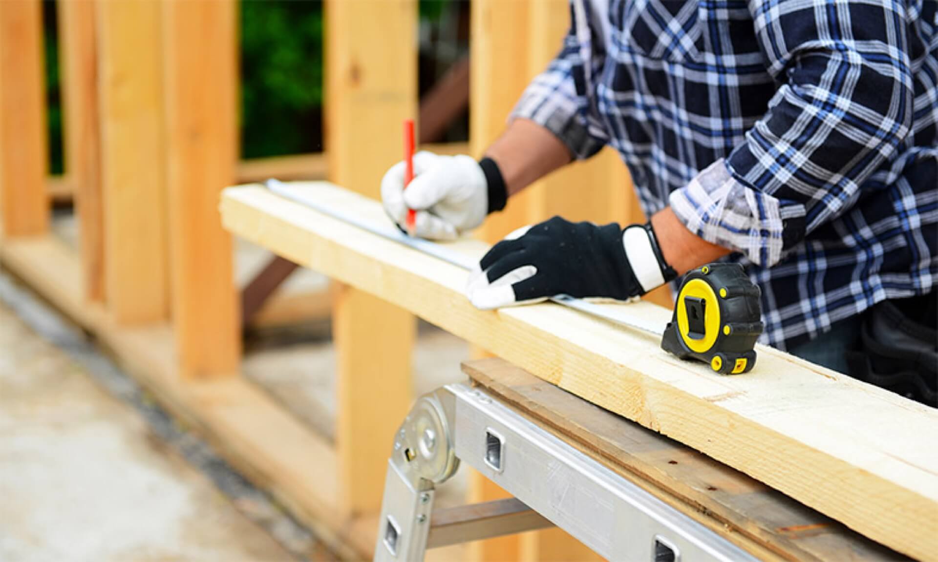 man building a frame under for RWC home